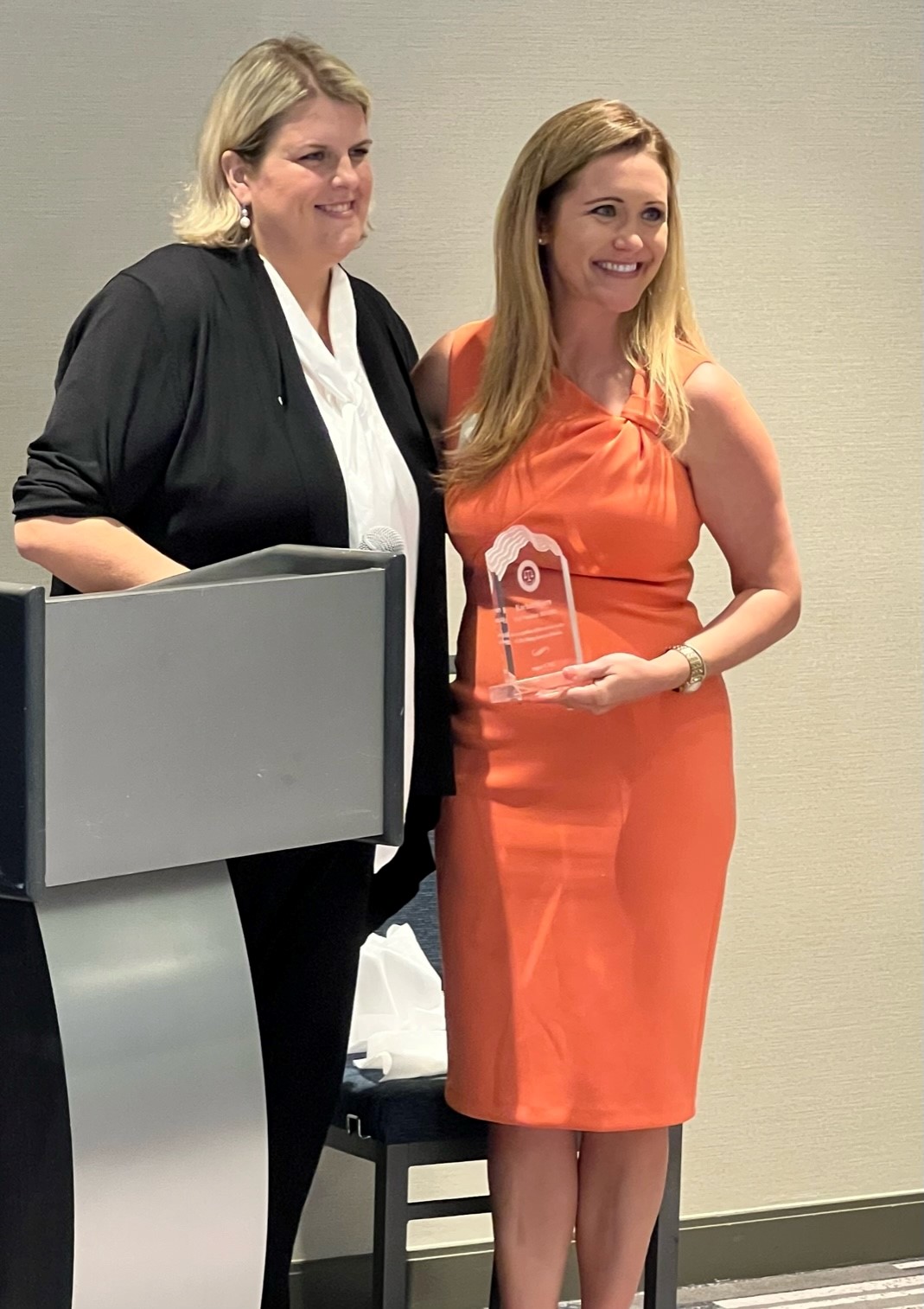 Attorney Amber Davids presents Honorable Judge Rachel D. Myers with a Service Award on August 5, 2022.